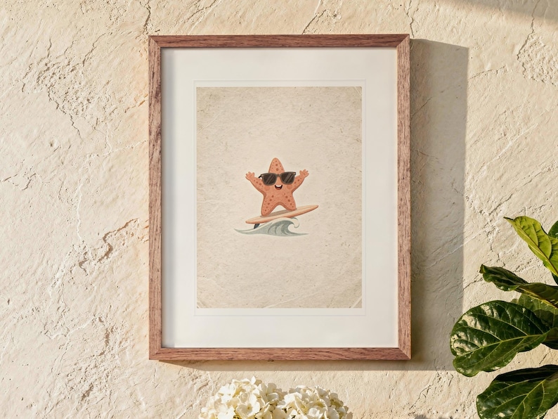 Surfing Starfish print in a Red Oak frame with a white mat, hanging above the table in a sunroom.