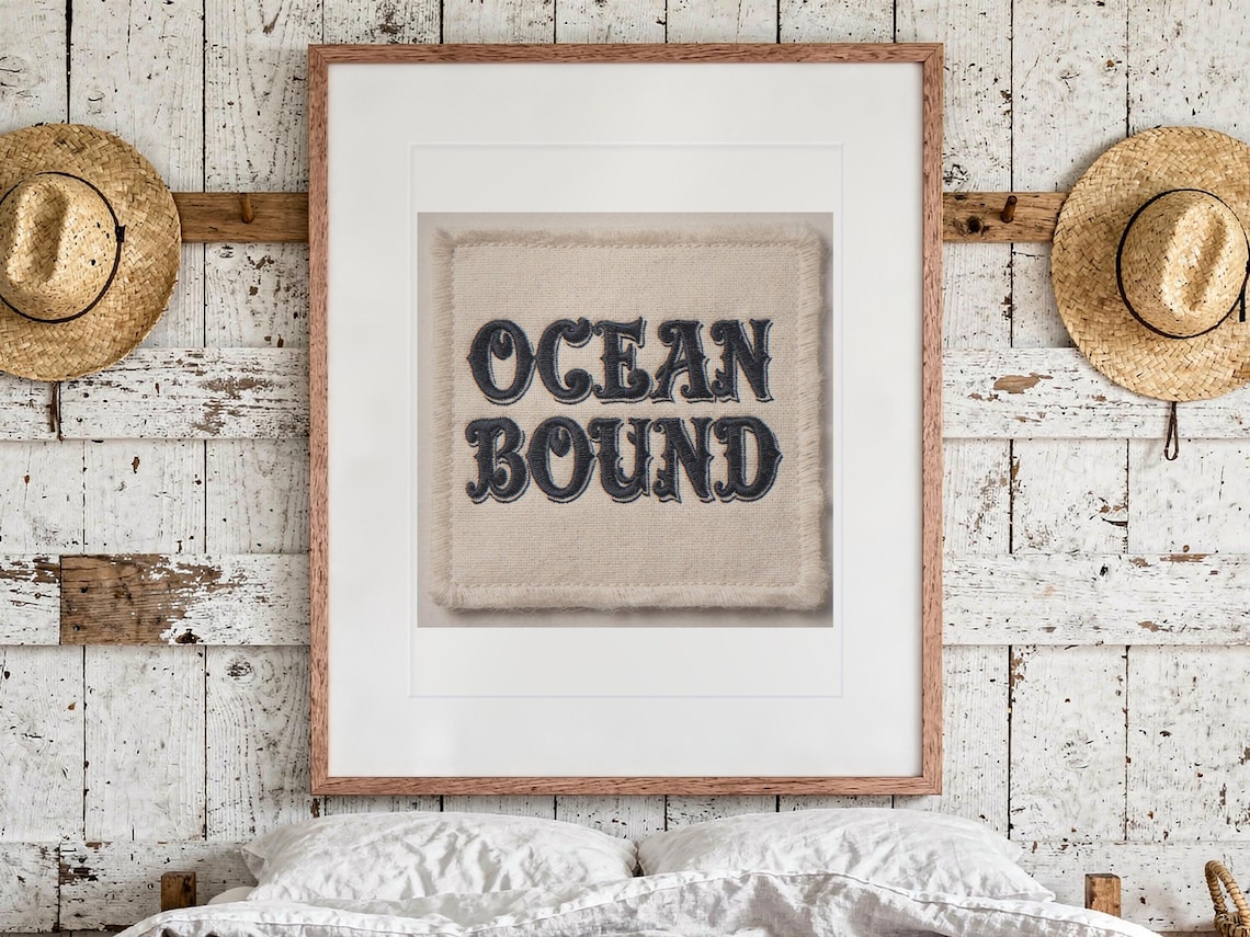 Ocean Bound Patch print in a Red Oak frame with a white mat, hanging above the bed in a surf shack bedroom.