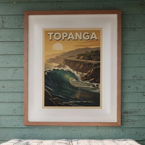 Topanga Surf Travel Poster print in a Red Oak frame with a white mat, hanging above the bench in a screened beach porch.