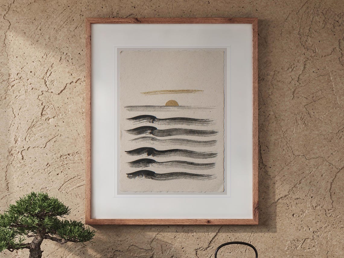 Layered Waves Ink Style print in a Red Oak frame with a white mat, hanging above the cabinet in a tea room.