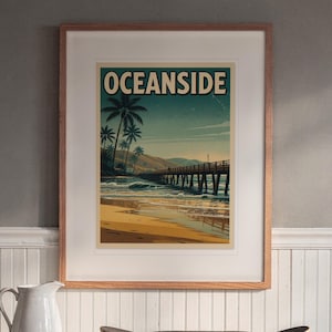 Oceanside California Surf Travel Poster print in a Red Oak frame with a white mat, hanging above the buffet in a dining room.