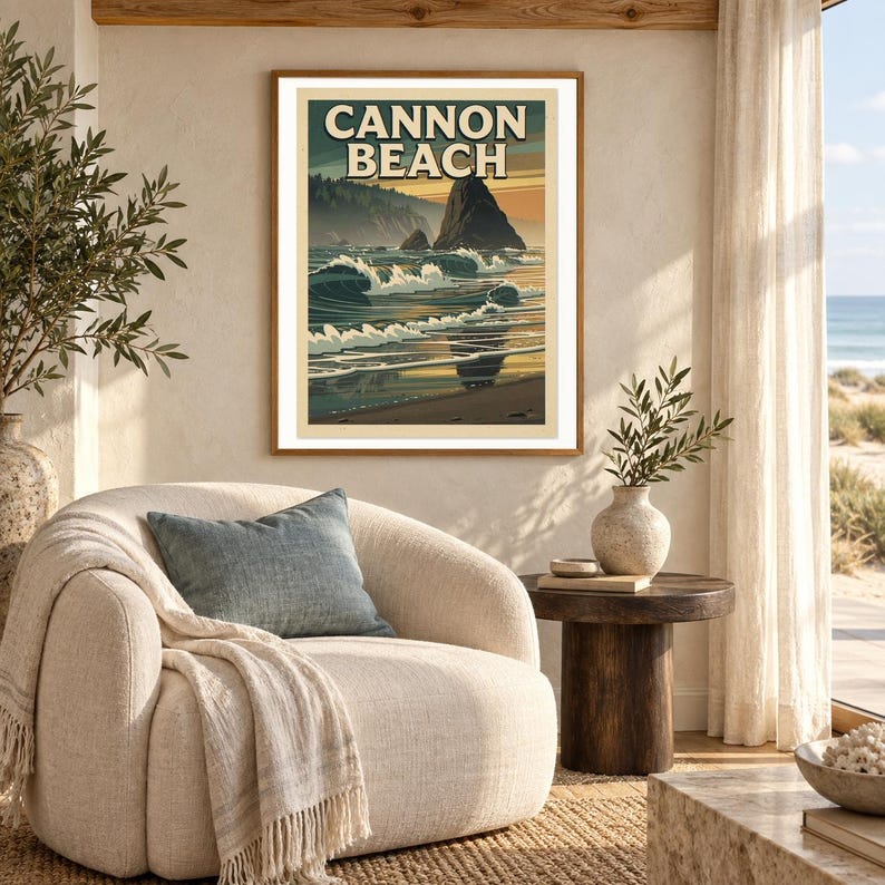 Cannon Beach Oregon Poster art print shown framed in a light-filled coastal living room (frame not included). RetroSwell digital download.