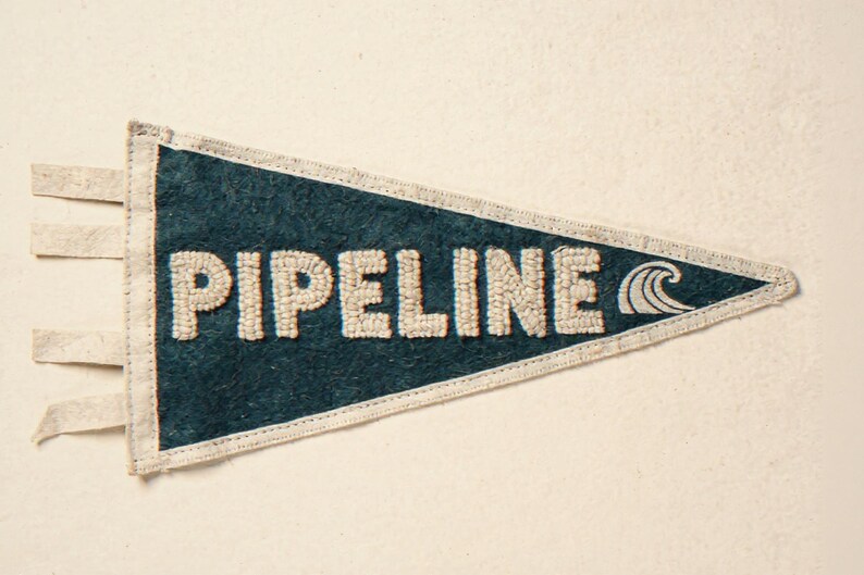 Pipeline Vintage Surf Pennant Print framed in a home office setting