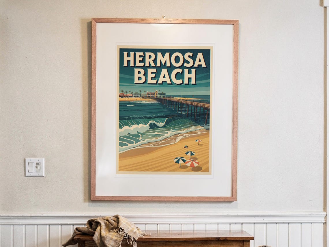 Hermosa Beach Surf Travel Poster print in a Red Oak frame with a white mat, hanging above the console in a hallway.
