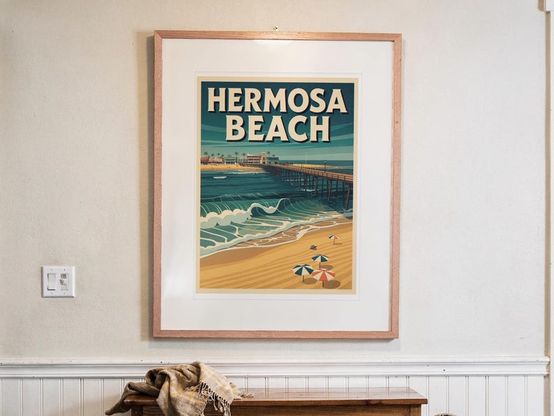 Hermosa Beach Surf Travel Poster print in a Red Oak frame with a white mat, hanging above the console in a hallway.