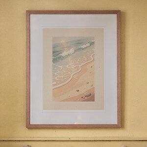 Ocean Waves print in a Red Oak frame with a white mat, hanging above the bench in a breakfast nook.