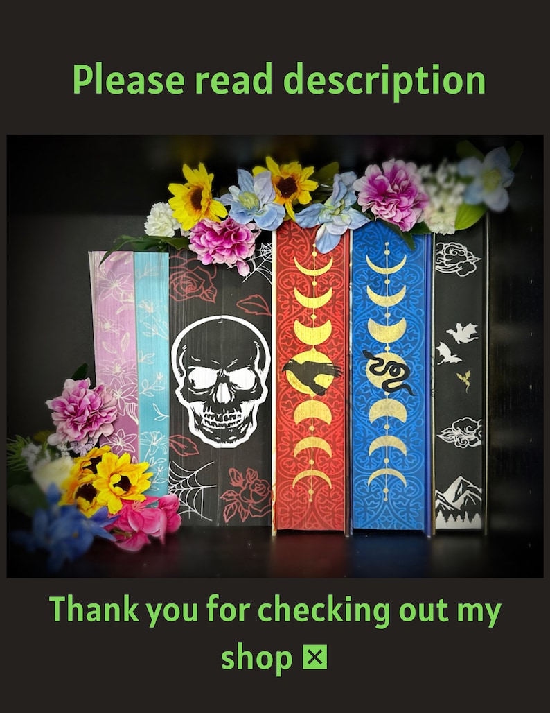 May include: Five decorative books with different designs. The book on the left has a skull and crossbones design. The next book has a moon and stars design. The third book has a snake design. The fourth book has a bird design. The fifth book has a mountain design. The books are decorated with flowers.