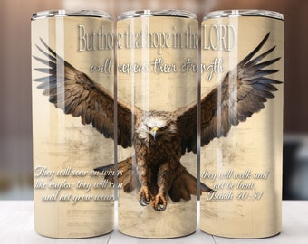 May include: A stainless steel tumbler with a brown eagle design and a beige background. The tumbler features the text "But those that hope in the LORD will renew their strength" and "They will soar on wings like eagles: they will run and not grow weary" on the left side. The right side features the text "they will walk and not be faint Isaiah 40:31".
