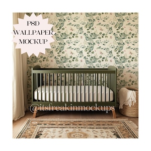May include: A green crib with a white mattress and a white blanket in a nursery with a green and white floral wallpaper. The text "PSD WALLPAPER MOCKUP" is on a pink starburst.