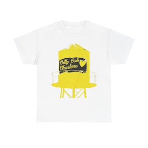 May include: White t-shirt featuring a yellow water tower design with the text "Billy Bob Charlene" and a heart. The water tower graphic has a black background. The shirt is a casual wear item.