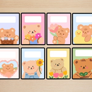 May include: Eight colorful printable planner stickers featuring cute cartoon bears with different floral and nature-themed designs. The stickers are perfect for adding a touch of whimsy to your planner or journal.