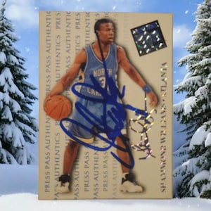 May include: A basketball trading card featuring a player in a light blue jersey with the number 3. The card has an autograph and the text "SHAMMOND WILLIAMS ATLANTA". The background includes the text "PRESS PASS AUTHENTICS".