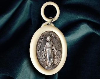 Rare Art Deco protective cradle medal from 1930 for the discerning collector