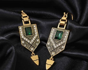 Stunning new, high-quality gold-bronze drop earrings in an antique boho style, set with emerald green crystals.