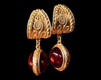 Superb large dangling earrings with carved arabesque studs in antique boho style gold set with a ruby cabochon