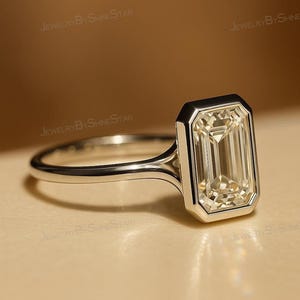 3 Carat Emerald Cut Lab Grown Diamond Engagement Ring: 14K Gold Bezel Solitaire
