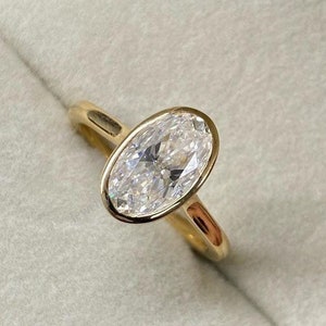 2.25 Ct Elongated Oval Lab Grown Diamond 14K Yellow Gold Bezel Engagement Ring