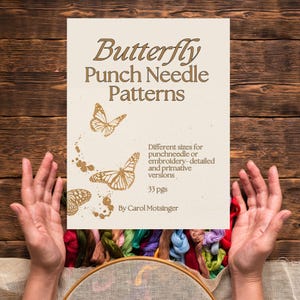 May include: A white sheet of paper with the text "Butterfly Punch Needle Patterns" in gold lettering. The paper features several gold butterfly illustrations and the text "Different sizes for punchneedle or embroidery-detailed and primitive versions. 33 pgs. By Carol Motsinger".