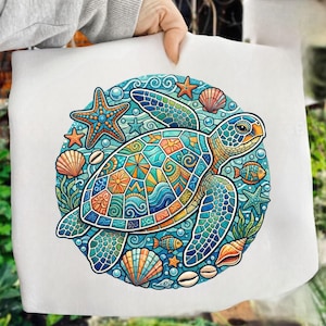 May include: A colorful illustration of a sea turtle surrounded by starfish, seashells, and fish. The turtle's shell features a mosaic pattern in shades of blue, green, orange, and yellow. The artwork is set against a light blue background with bubbles.
