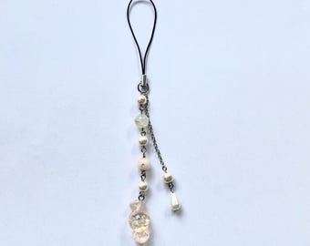 Breloque pour téléphone en perles roses et blanches et breloque bonbon
