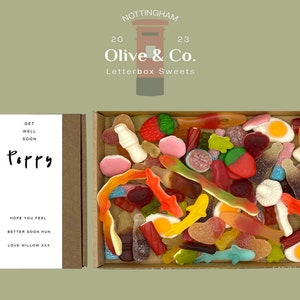 May include: A letterbox-sized box of sweets with a variety of colourful gummy candies. The box is open, revealing a mix of shapes and colours. A smaller box is next to it with a white label that says "Get Well Soon Poppy" and "Hope you feel better soon hun, love Willow xxx."