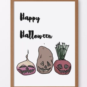 May include: A framed print with the text "Happy Halloween" and a cartoon illustration of three vegetables with jack-o'-lantern faces. The vegetables are a turnip, a potato, and a beet.