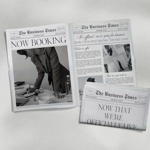 May include: Newspapers with the headline "The Business Times" are displayed. One paper reads "NOW BOOKING," another states "It's official: we're open for business," and a third says "NOW THAT WE'RE OFFICIALLY LIVE."