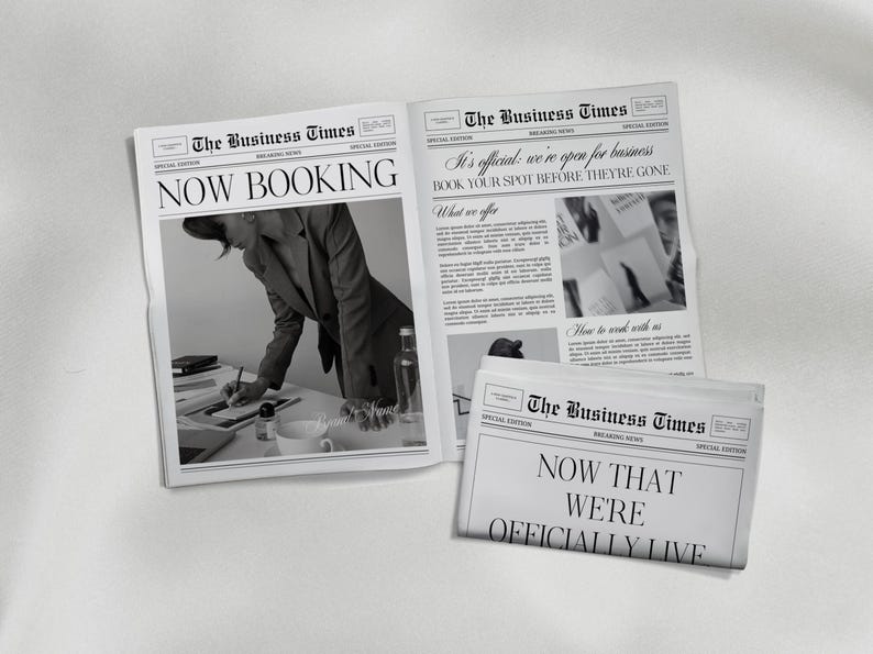May include: Newspapers with the headline "The Business Times" are displayed. One paper reads "NOW BOOKING," another states "It's official: we're open for business," and a third says "NOW THAT WE'RE OFFICIALLY LIVE."