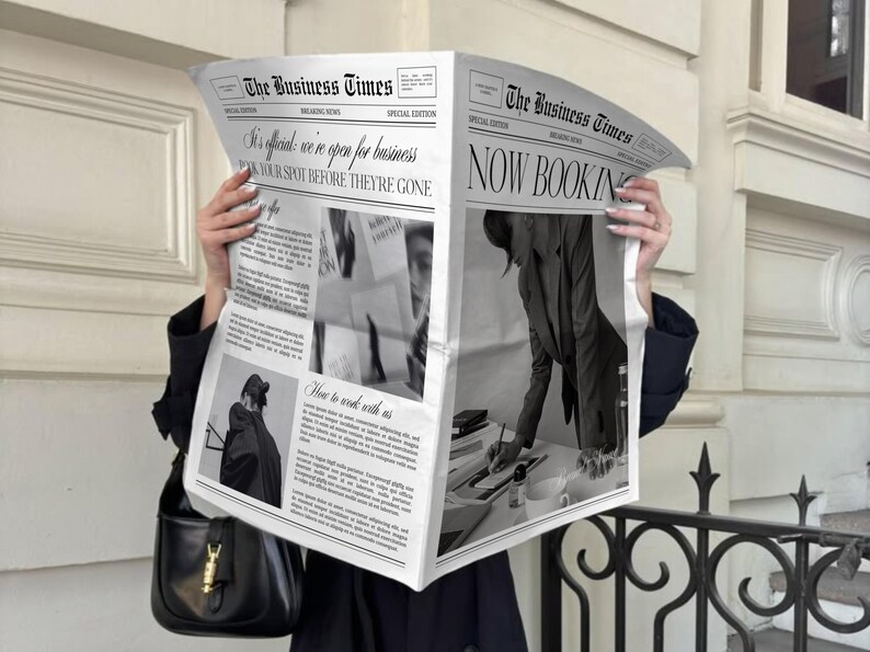 May include: A person holding open a newspaper titled "The Business Times." The newspaper's headline reads "NOW BOOKING" and includes the text "It's official, we're open for business. BOOK YOUR SPOT BEFORE THEY'RE GONE."