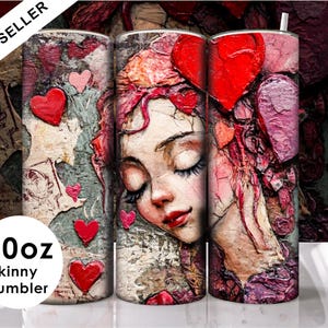 Puede incluir: Un vaso delgado de 20 oz con un diseño abstracto colorido que presenta un rostro de mujer con los ojos cerrados, corazones rojos y un patrón floral rosa y rojo. El vaso está hecho de acero inoxidable y es perfecto para mantener las bebidas frías o calientes.