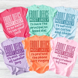 May include: Six colorful t-shirts with the text "FRONT OFFICE MOST LIKELY" and various humorous phrases. Colors include pink, mint green, light blue, lavender, orange, and light pink. The shirts are casual wear.
