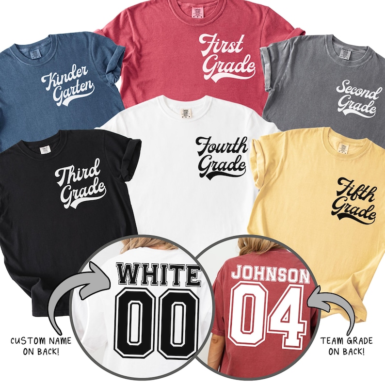 May include: Various coloured t-shirts with grade level text, including "Kindergarten", "First Grade", "Second Grade", "Third Grade", "Fourth Grade", and "Fifth Grade". Two shirts show custom names and team grades on the back.