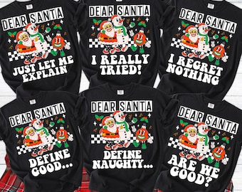 May include: Black graphic t-shirts with the text "DEAR SANTA" and various phrases like "JUST LET ME EXPLAIN" and "I REGRET NOTHING." Each shirt features a cartoon Santa and snowman design with Christmas ornaments.