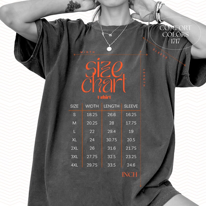 May include: Dark grey t-shirt with an orange size chart graphic. The chart displays measurements in inches for width, length, and sleeve length for sizes S through 4XL. The text "COMFORT COLORS 1717" is also visible.