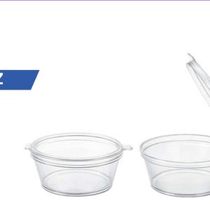 May include: Two clear plastic portion cups with attached lids, each with a capacity of 1 oz. One cup is shown with the lid closed, while the other is shown with the lid open, revealing the interior. The text 1 OZ is displayed in a blue banner.