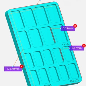 May include: A turquoise blue plastic mold with 18 rectangular cavities. The mold is 127 mm wide and 172.40 mm long. The text "WHS MARKERS" is printed on the mold.