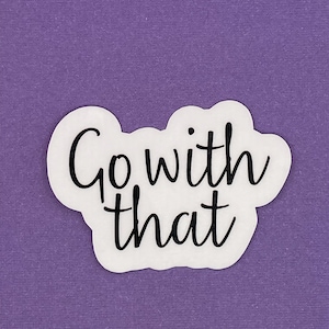 May include: White sticker with black text that reads "Go with that" on a purple background.