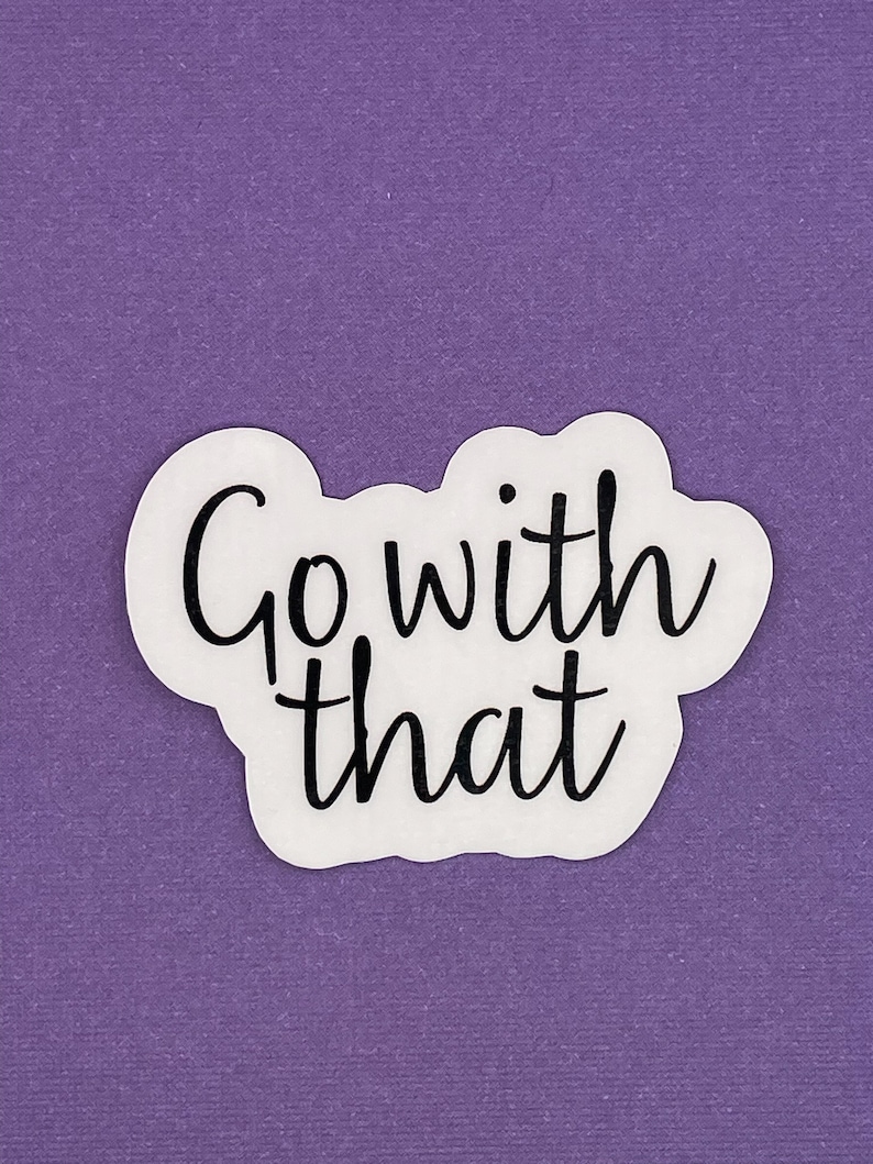 May include: White sticker with black text that reads "Go with that" on a purple background.