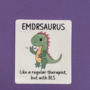 May include: A sticker with a cartoon dinosaur and the text "EMDRSAURUS Like a regular therapist, but with BLS".