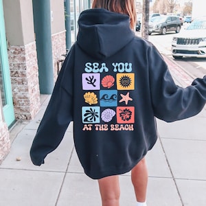 Seaside Escape Hoodie | Oversized Coastal Style Unisex Hoodie | Boho Nautical Seashells Graphic Hoodie, Beach Day Hoodie