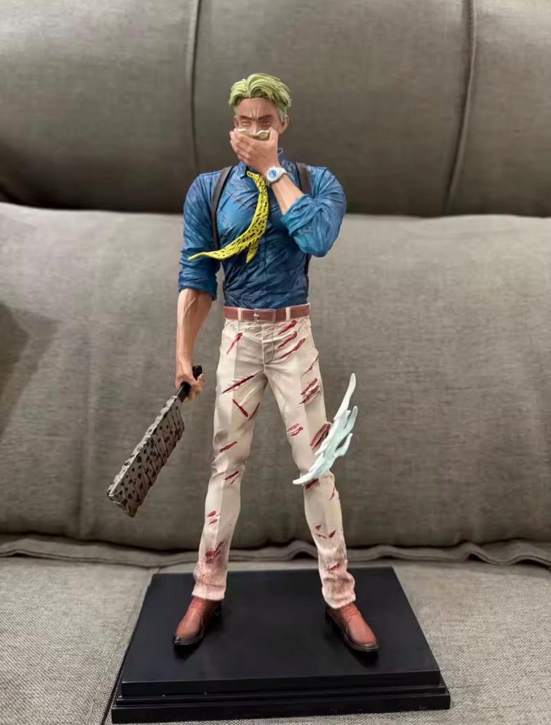 May include: A detailed figurine of a character in a blue shirt, yellow tie, and white pants with red accents. The figure holds a cleaver and a translucent blue energy effect. The figure is standing on a black base.