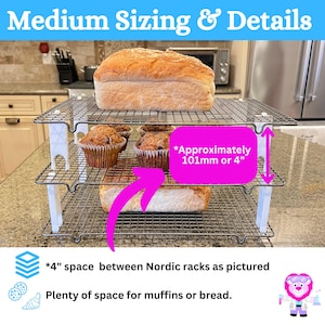 Medium cooling rack stackers with cookies on the racks.