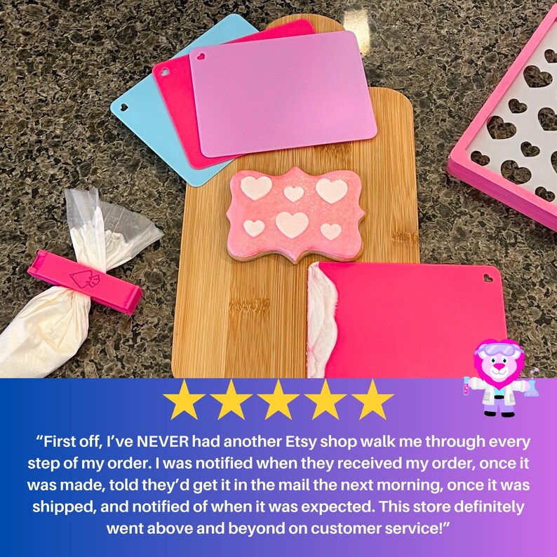 Icing Scrapers in hot pink, lavender and light blue with cookie stencil and piping bag with matching clip.