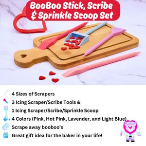 May include: A set of four silicone baking tools in pink, hot pink, lavender, and light blue. The tools include three icing scrapers, one scribe, and one sprinkle scoop. The tools are on a wooden cutting board with red heart sprinkles. The text "BooBoo Stick, Scribe & Sprinkle Scoop Set" is at the top of the image.