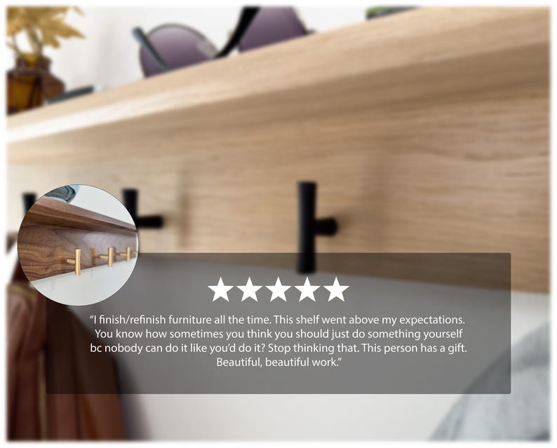 May include: A wooden shelf with black and gold hooks. The shelf is made of light-colored wood and has a dark wood section with gold hooks. The shelf is mounted on a wall and has a minimalist design.