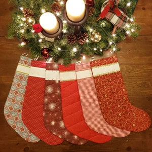 Handmade Christmas Stockings with Cross Stitch Personalization. Stockings are quilted and fully lined.  Large size holds lots of goodies!