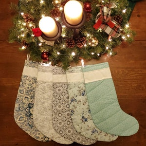 Handmade Christmas Stockings with Cross Stitch Personalization. All stockings are quilted and fully lined. Large size holds lots of goodies!
