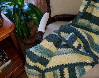 Handmade crocheted afghan in a rich butter yellow with green/blue toned multi. Large 50x53 tightly stitched for warmth for those cool nights