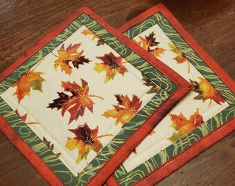 Handmade Quilted Hot Pad Trivets are insulated for heat protection. Bright natural earth tone add color to your table setting. 2pk