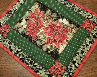 Handmade Quilted Hot Pad Trivets are insulated for heat protection. Holiday poinsettias bring the holidays home for you and yours.